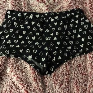 Black shorts with white hearts